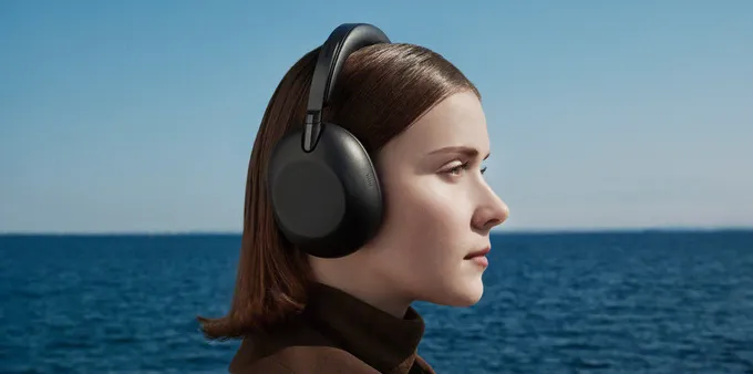 Woman wearing the Sony 1000X The ColleXion headphones