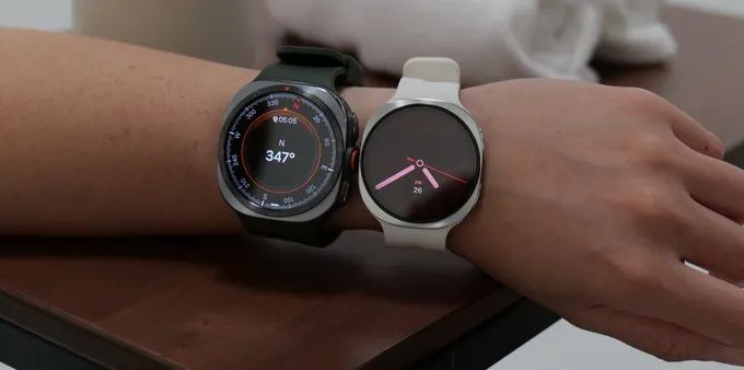 Two smartwatches on a person's wrist.