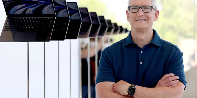 Apple's ex-CEO Tim Cook looks at brand-new redesigned MacBook Air laptops