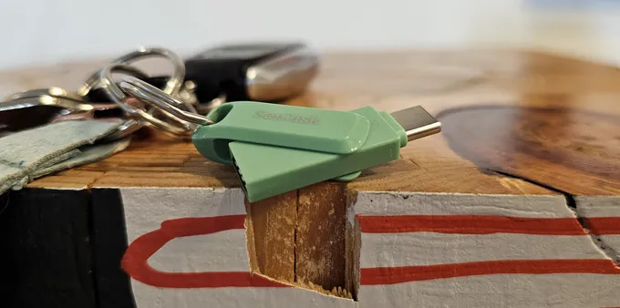 A SanDisk flash drive on a keychain.